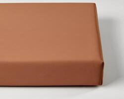 Smooth orange surface creating a warm and minimalist background photo