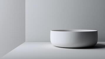 Ceramic white bowl resting in a minimalistic setting with soft lighting in a modern interior photo