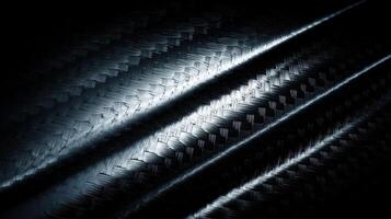Forged carbon fiber background with dramatic patterns emphasizing texture and depth in black and silver hues photo