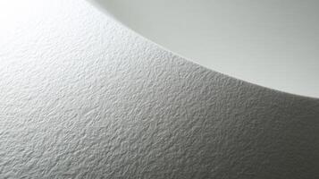 Ceramic white surface displaying a textured pattern and subtle imperfections up close photo
