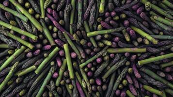 Dense arrangement of fresh green asparagus spears in a colorful display at a local market photo