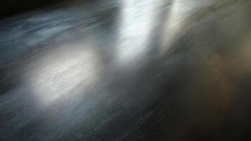 Faint oil slick patina on a polished titanium surface in a soft light setting photo