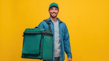 Food delivery person smiling proudly after completing a successful delivery in a bright yellow setting photo