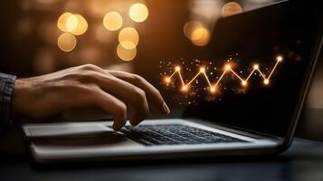 Laptop Chart Analysis Man's Hand Typing on Laptop with Glowing Financial Growth Chart Displayed On Screen photo
