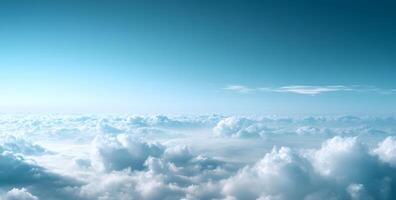 A mesmerizing view showcases fluffy white clouds nestled under a clear, bright blue sky photo