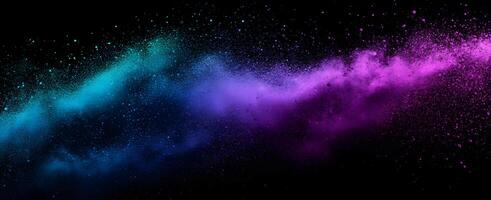 A vibrant blend of cyan and magenta powder explodes against a stark black backdrop photo