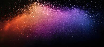 Abstract background displaying a gradient from orange to purple created by particles on black photo