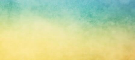 Abstract background shows yellow smoothly transitioning into turquoise, and has a subtle, textured appearance photo