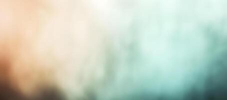 An abstract background displays a smooth gradient from peach to teal, creating a soft effect photo