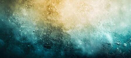 An abstract textured surface is displayed with a gradient from gold to teal photo