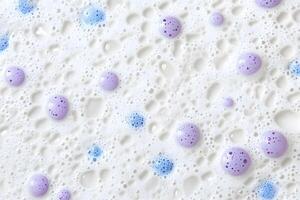 Bubbly surface exhibits a delightful array of textures with both blue and lilac colored blobs photo