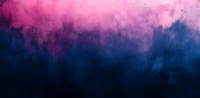 Delicate pink diffuses into inky blue creating a deeply atmospheric and textured background photo