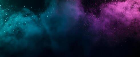 Teal dust and purple glitter merge elegantly on a dark smoky background creating depth photo