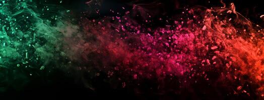 Teal and pink dust clouds create a mesmerizing burst on a stark dark background photo