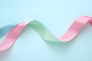 Wavy pink and teal ribbons intertwine elegantly against a soft light blue backdrop, creating harmony photo