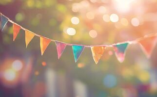 Colorful triangular festive flags hung horizontally create a joyful atmosphere amidst blurred lights, creating a happy vibe photo