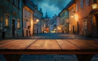 Wooden table surface with blurred vintage European architecture street buildings at twilight provides a scenic background photo