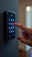 A person pressing the button on a smart lock photo