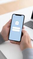 A man holding a smartphone with a lock icon on the screen photo