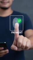 Man touching finger on payment button photo