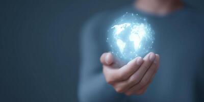 Hand holding glowing digital globe with world map representing global connectivity and technology concept in a modern digital age photo