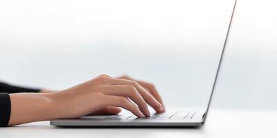 Hands typing on a laptop keyboard with a blurred background creating a modern workspace atmosphere and technology concept photo