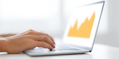 Hand typing on laptop with financial graph displayed on screen showcasing data analysis and productivity in a modern workspace healthy business concept photo