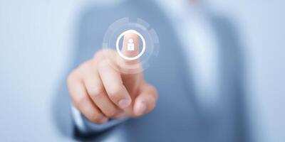 Businessman pressing button on touch screen with security icon photo