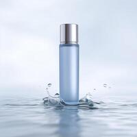 Clear glass bottle filled with blue liquid, standing in calm water, reflecting soft light, creating a serene and refreshing atmosphere for beauty products photo