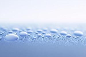 Water droplets on a surface with a blue background photo