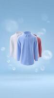 Three stylish shirts in blue, white, and red colors floating against a soft blue background with bubbles creating a fresh and modern atmosphere photo