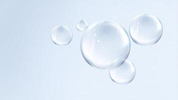 Transparent soap bubbles floating gracefully against a soft blue background creating a serene and calming atmosphere with copy space for text overlay photo