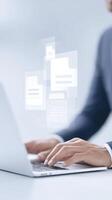 Professional hands typing on laptop with floating digital documents and files representing modern technology and data management in a professional environment photo