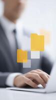 Business professional interacting with digital file icons on laptop, showcasing modern technology and innovative workspace concepts with copy space photo