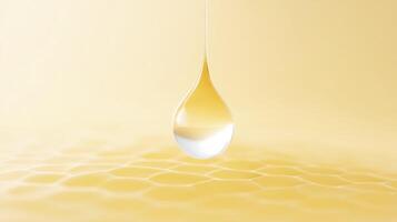 A drop of honey is hanging from a honeycomb photo