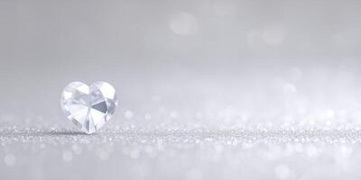 A diamond heart shaped object on a silver background photo