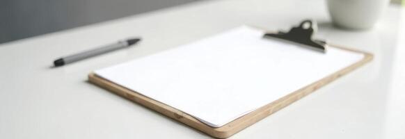 Blank clipboard on a clean desk with a pen and a cup, ideal for notes and ideas, workspace organization concept photo