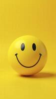 Yellow sphere showing a smiling face on a yellow background photo