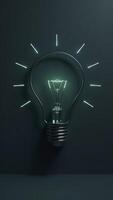 Light bulb shining with glowing rays symbolizing ideas and innovation photo