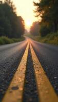 Winding country road leading to sunrise destination at dawn photo