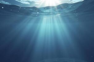 Sunlight piercing through ocean surface creating beautiful underwater beams photo
