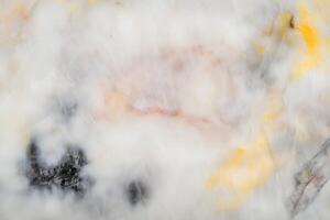 Abstract texture with black and yellow patterns on smooth white surface photo