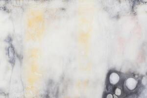 Textured abstract marble surface with subtle earth tones and organic patterns photo