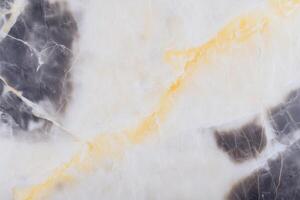 Close-up of polished natural onyx stone surface with intricate patterns photo