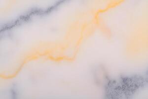 Smooth white and orange marble texture with subtle veining patterns photo