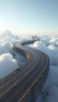 Winding road paved with asphalt floating through the clouds photo