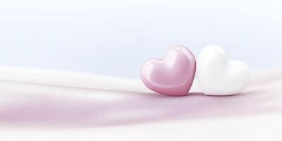 Two glossy heart-shaped objects, one pink and one white, resting on a soft fabric surface with a gentle gradient background, symbolizing love and affection in a romantic setting photo