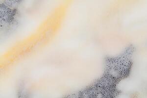 Marble texture with creamy swirls and subtle gray patterns photo