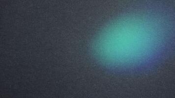 Soft gradient glow on a textured dark surface photo