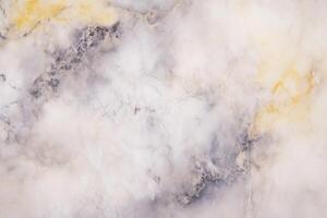 Elegant marble texture with subtle yellow and gray patterns photo